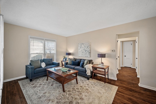 living room with dark wood-type flooring and baseboards