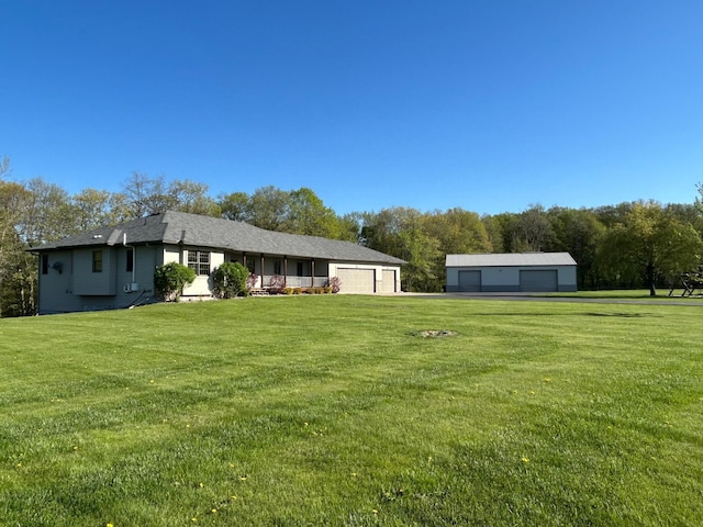 16110 Giefer Ave, Nerstrand, MN 55053 - view of green lawn featuring a garage