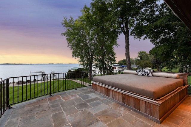 view of patio with a water view