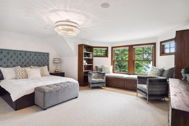 bedroom featuring multiple windows, an inviting chandelier, and light colored carpet