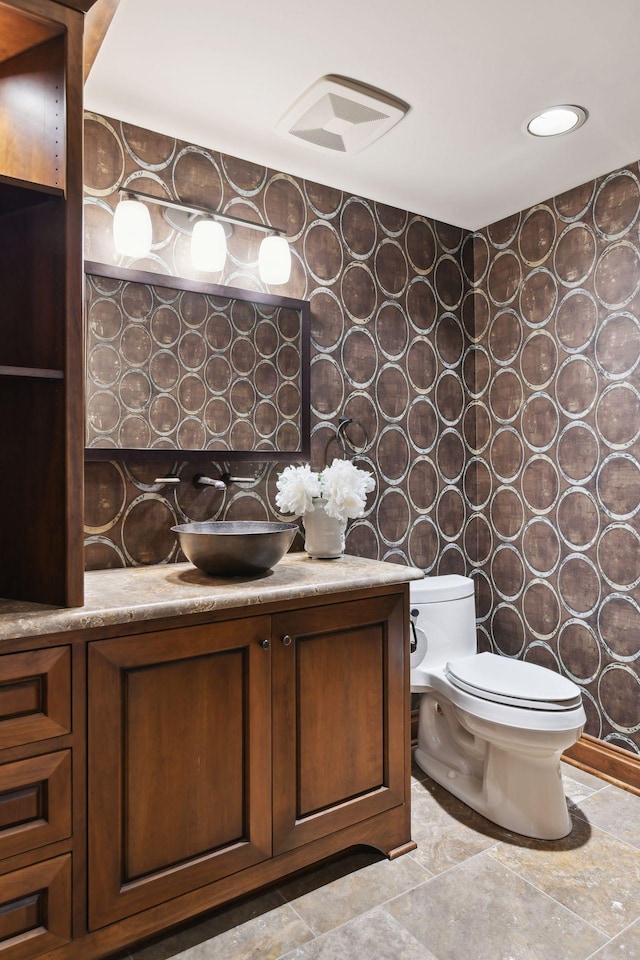 bathroom with vanity and toilet