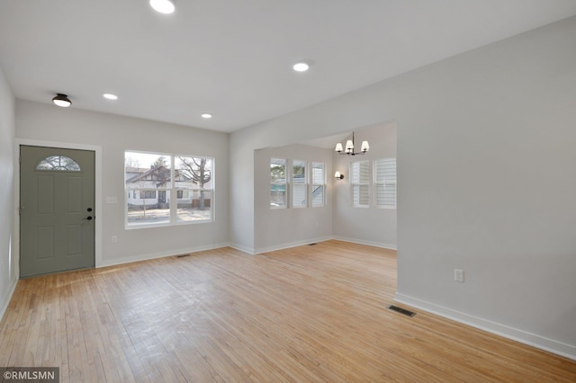 entryway featuring light wood finished floors, recessed lighting, visible vents, and baseboards