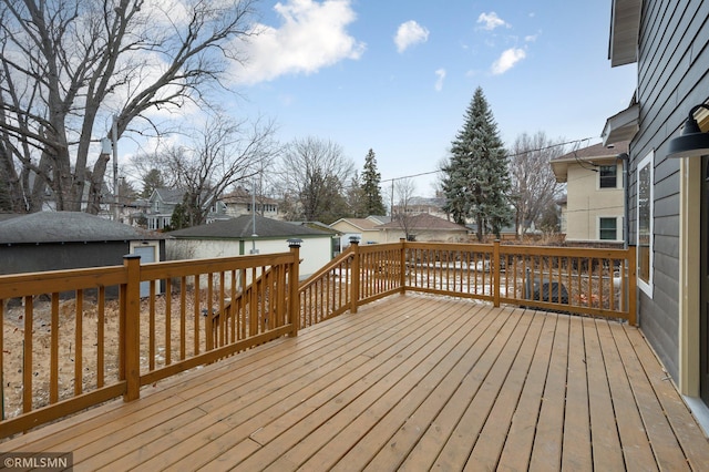 wooden deck featuring a residential view