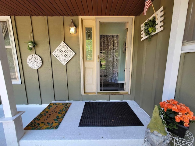 entrance to property featuring board and batten siding