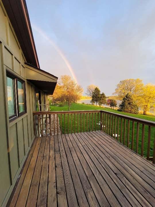 wooden deck featuring a yard