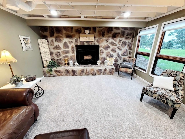 living room with carpet and a fireplace