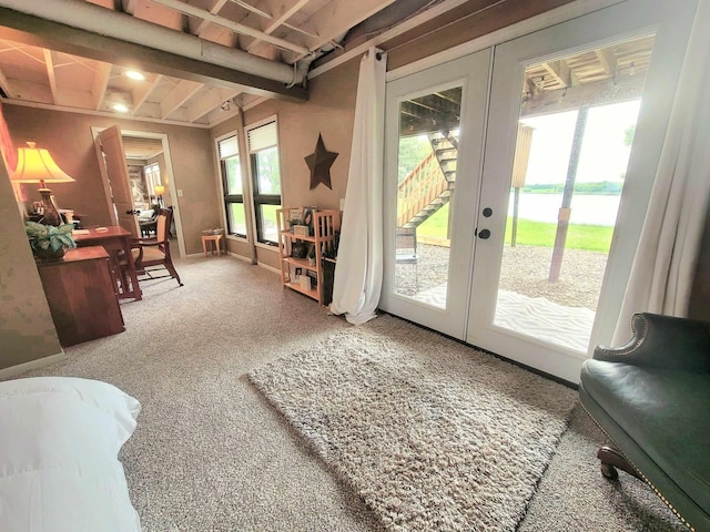 entryway with carpet floors, french doors, and baseboards