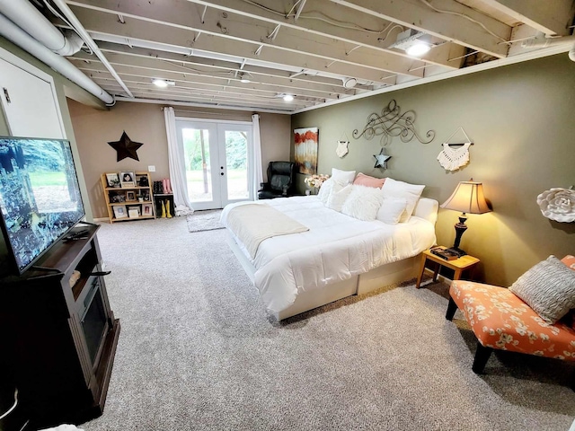 bedroom with access to exterior, carpet, and french doors