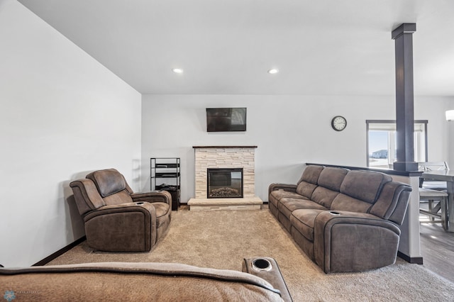 carpeted living room featuring a fireplace, baseboards, and recessed lighting