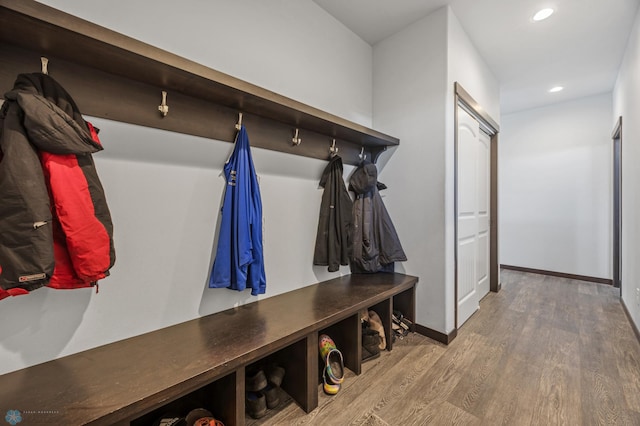 mudroom with recessed lighting, baseboards, and wood finished floors