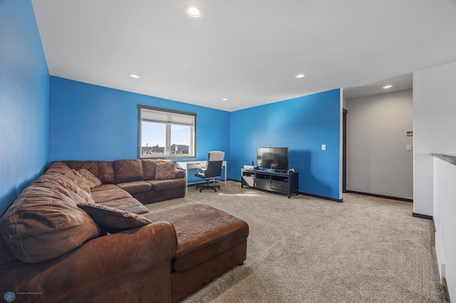 carpeted living room with recessed lighting and baseboards