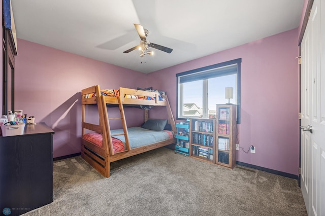 bedroom featuring carpet, baseboards, and a ceiling fan