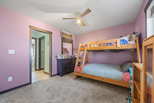 bedroom with ceiling fan, carpet floors, and baseboards