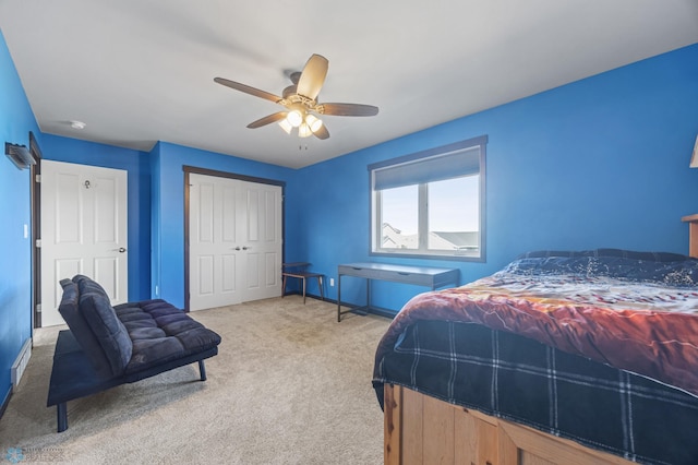 bedroom with a closet, carpet, and a ceiling fan