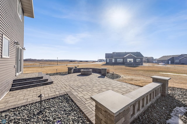 view of patio featuring a fire pit