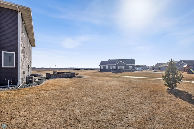 view of yard featuring central AC unit