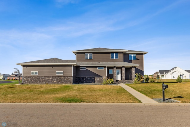 530 Piper St, Kindred, ND 58051 - view of front of house featuring a front lawn and stone siding