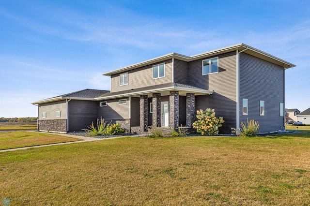 530 Piper St, Kindred, ND 58051 - view of front of property featuring stone siding and a front yard