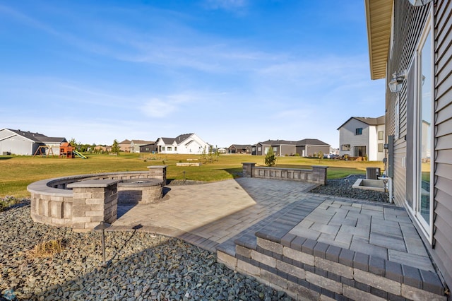 530 Piper St, Kindred, ND 58051 - view of yard featuring a residential view, a fire pit, central air condition unit, a playground, and a patio