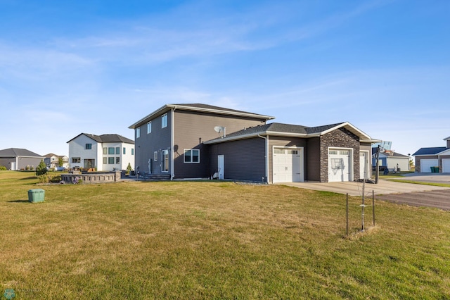 530 Piper St, Kindred, ND 58051 - view of property exterior with concrete driveway, a residential view, a yard, and a garage