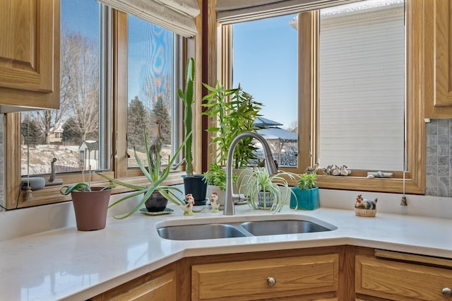 kitchen with light countertops and a sink