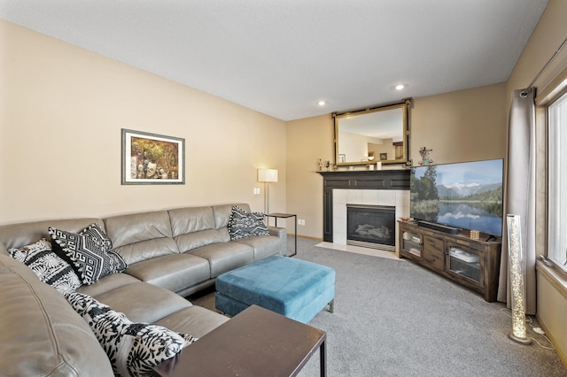 carpeted living room with recessed lighting, a fireplace, and baseboards