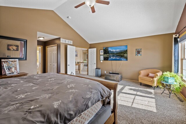 bedroom with ceiling fan, high vaulted ceiling, visible vents, baseboards, and carpet