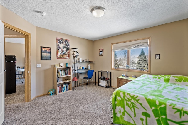 bedroom featuring carpet floors, baseboards, and a textured ceiling