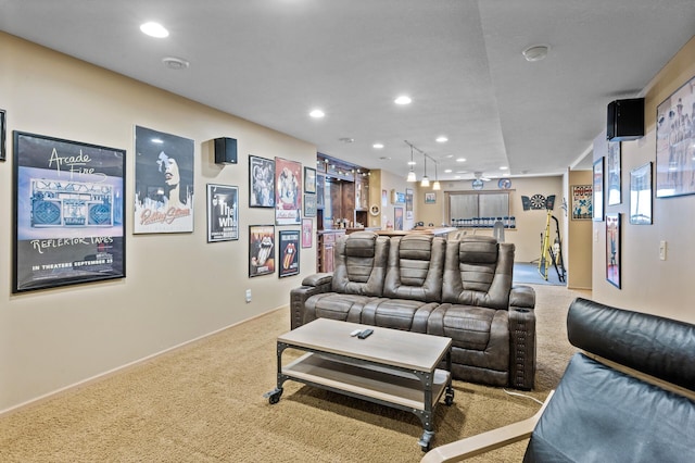 living area with light carpet and recessed lighting