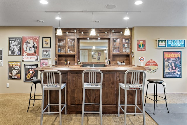 bar with carpet, wet bar, and pendant lighting