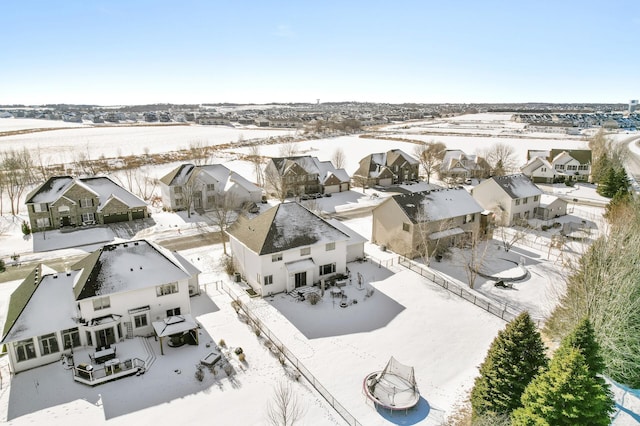 snowy aerial view with a residential view