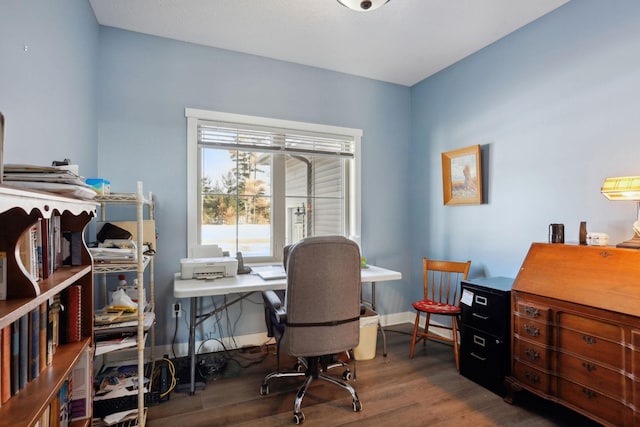 office space featuring baseboards and wood finished floors