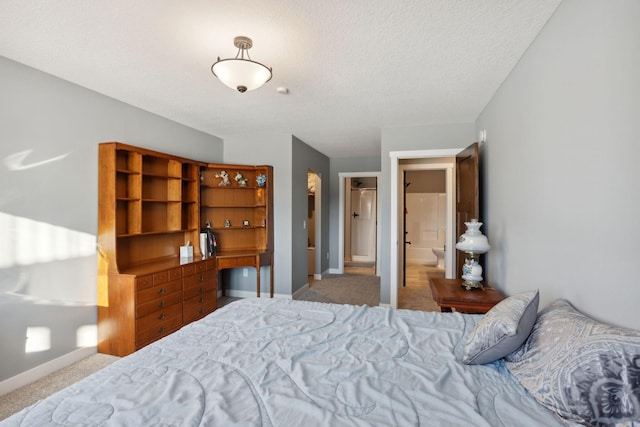 carpeted bedroom featuring a textured ceiling and baseboards