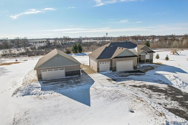 ranch-style house featuring a detached garage