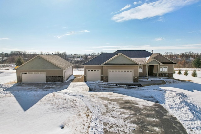 view of front of house with a garage and stone siding