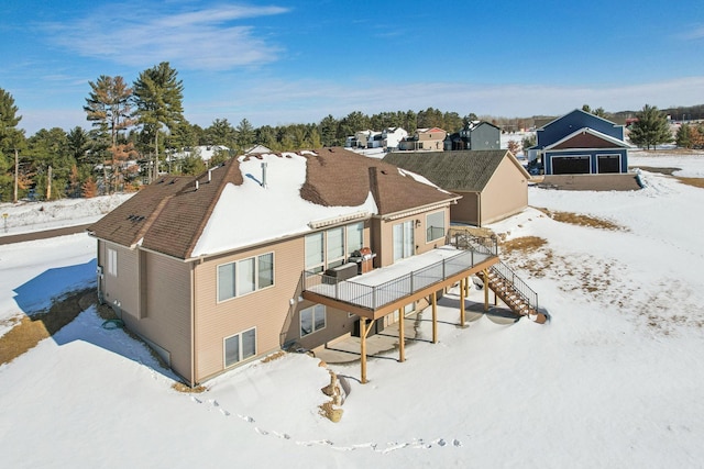 snow covered house with stairs