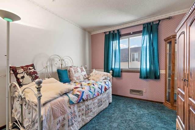 carpeted bedroom with a textured ceiling, baseboards, and wallpapered walls