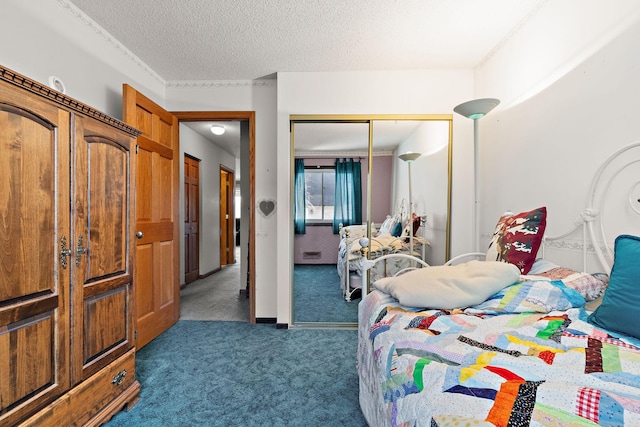 carpeted bedroom featuring a textured ceiling and a closet