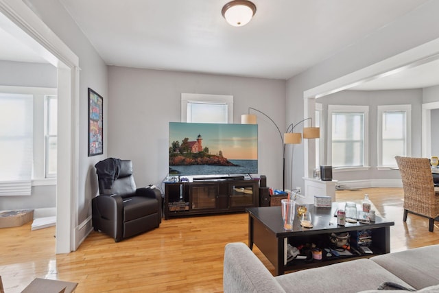 living room featuring light wood-style floors and baseboards