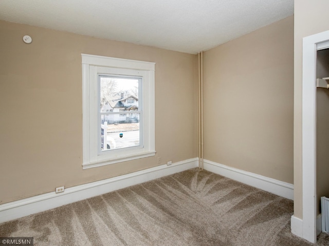 view of carpeted spare room