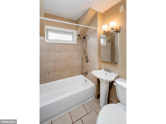 full bath with shower / washtub combination, tile patterned flooring, and toilet