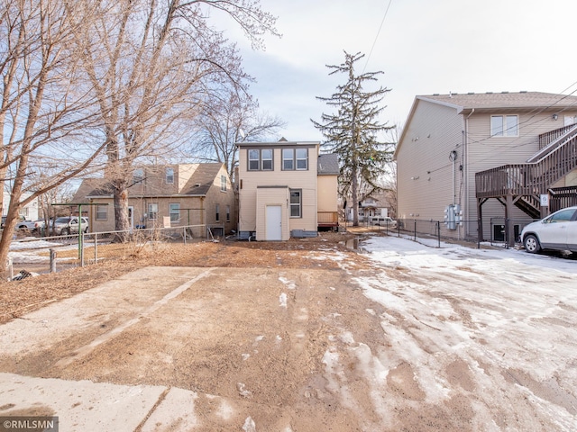 view of front of home with fence