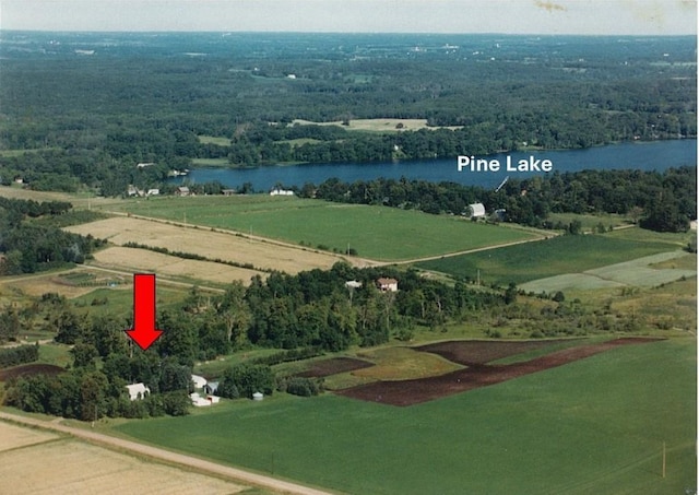 bird's eye view featuring a water view and a rural view