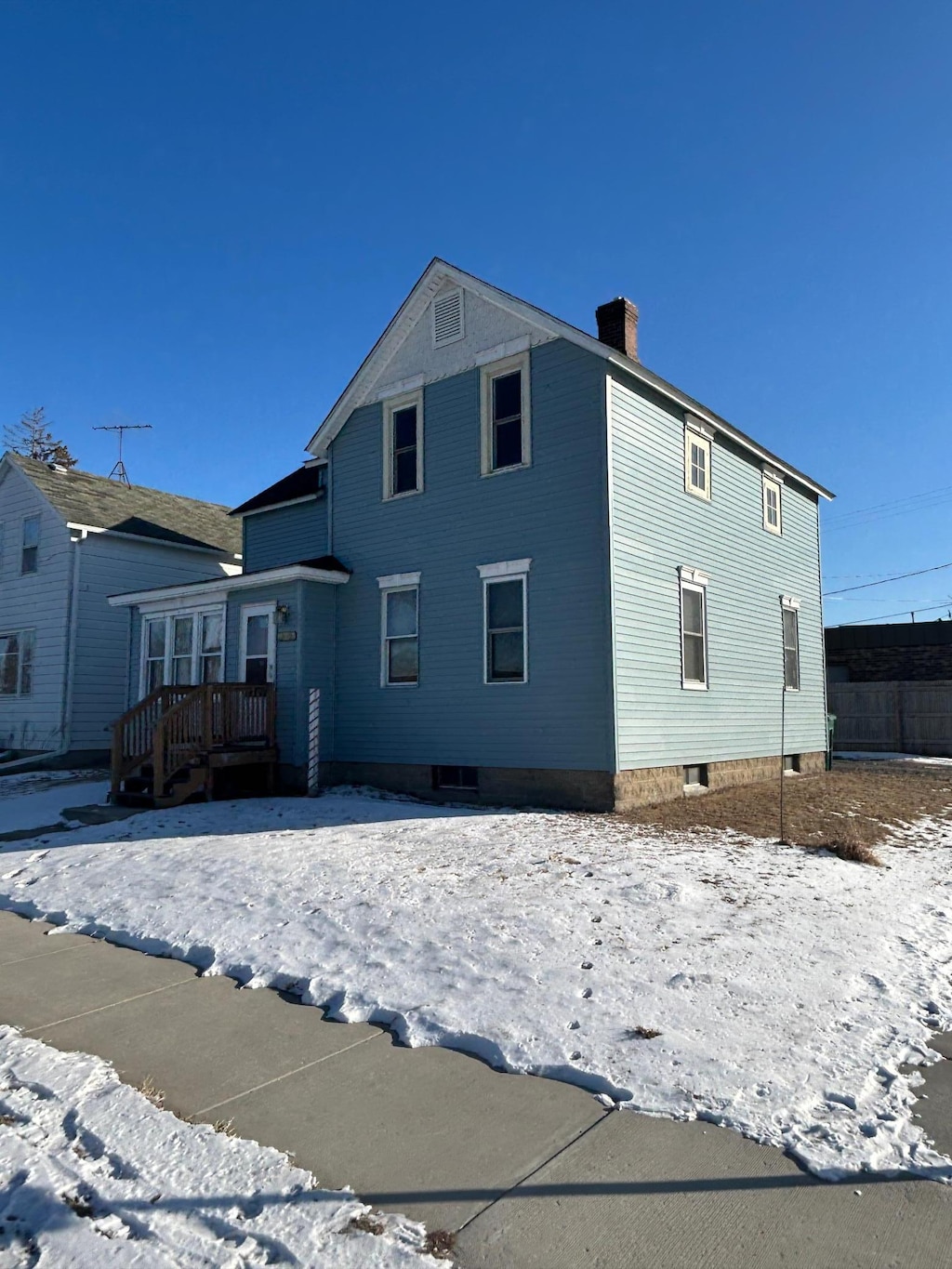 exterior space featuring a chimney