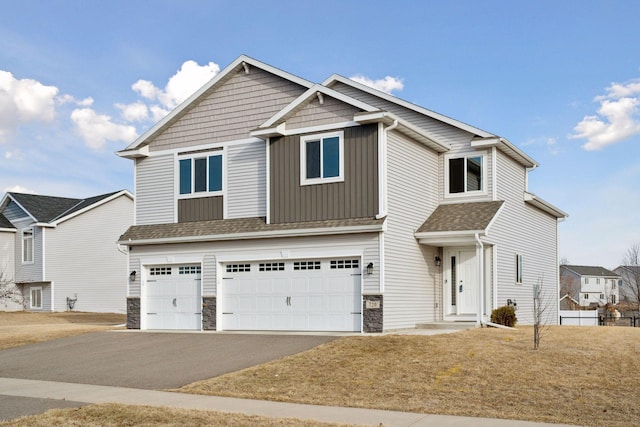 craftsman inspired home with stone siding, a garage, driveway, and a shingled roof