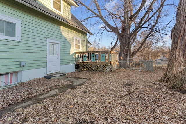 view of yard with fence and a wooden deck