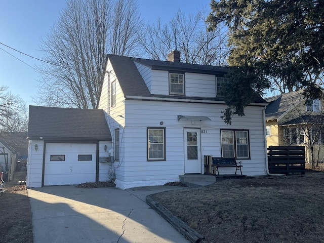 view of front facade featuring a garage, roof with shingles, driveway, and a chimney