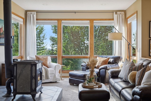 sunroom / solarium featuring a wood stove