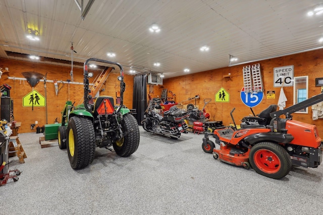 garage featuring wood walls