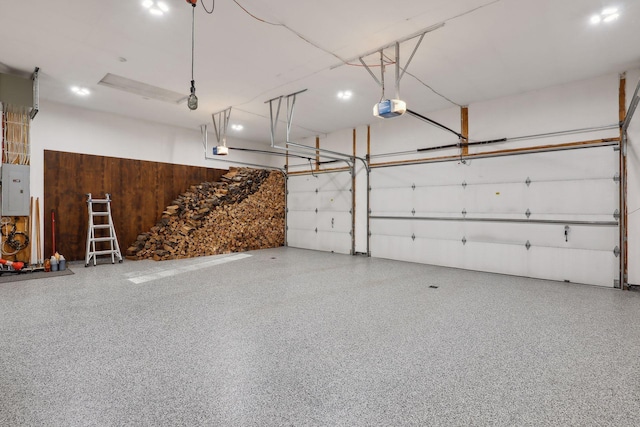 garage featuring electric panel and a garage door opener